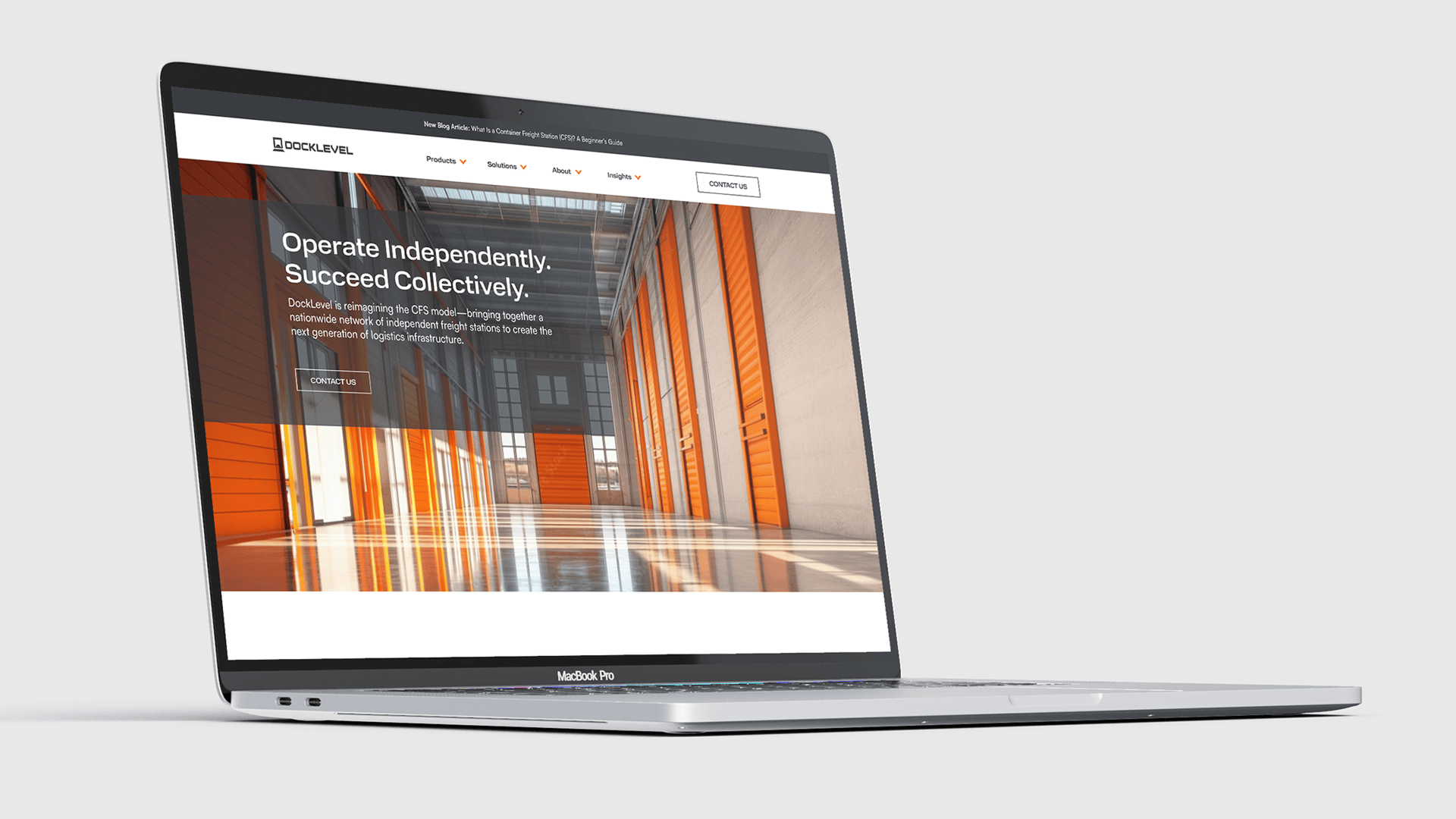 The Docklevel homepage is mocked up on a MacBook Pro