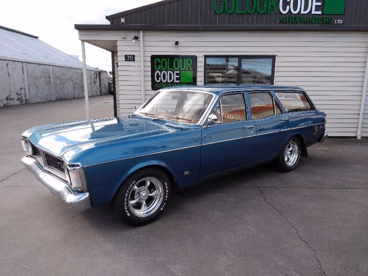 Blue Ford station wagon