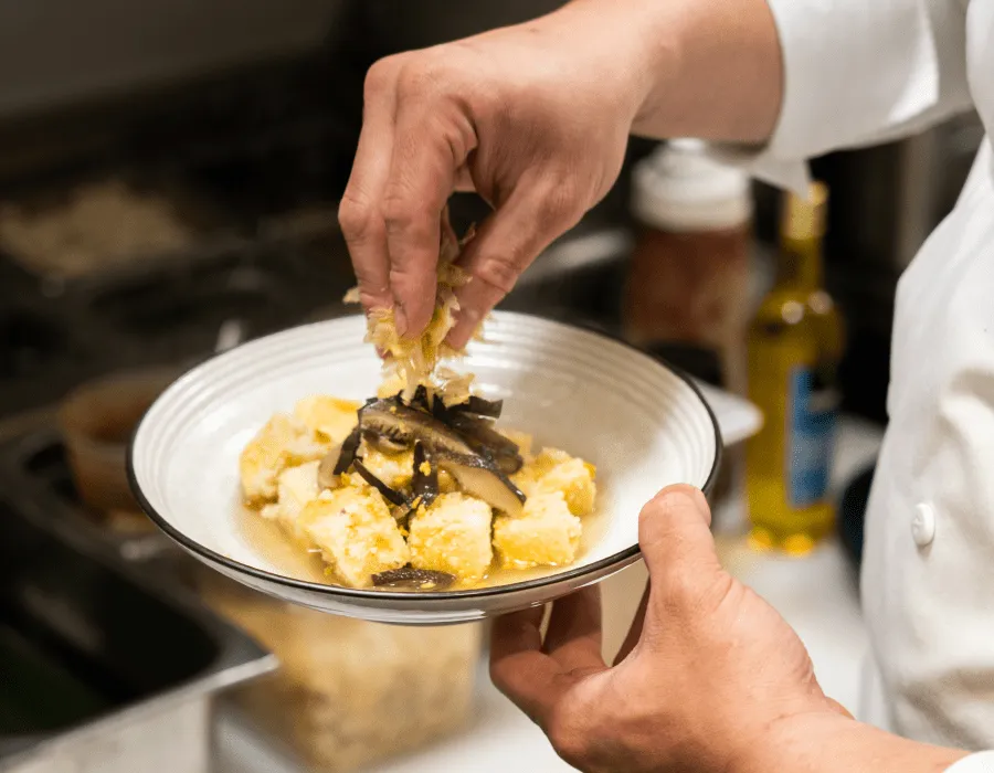Chef Ethan preparing dishes at Glassbox San Diego