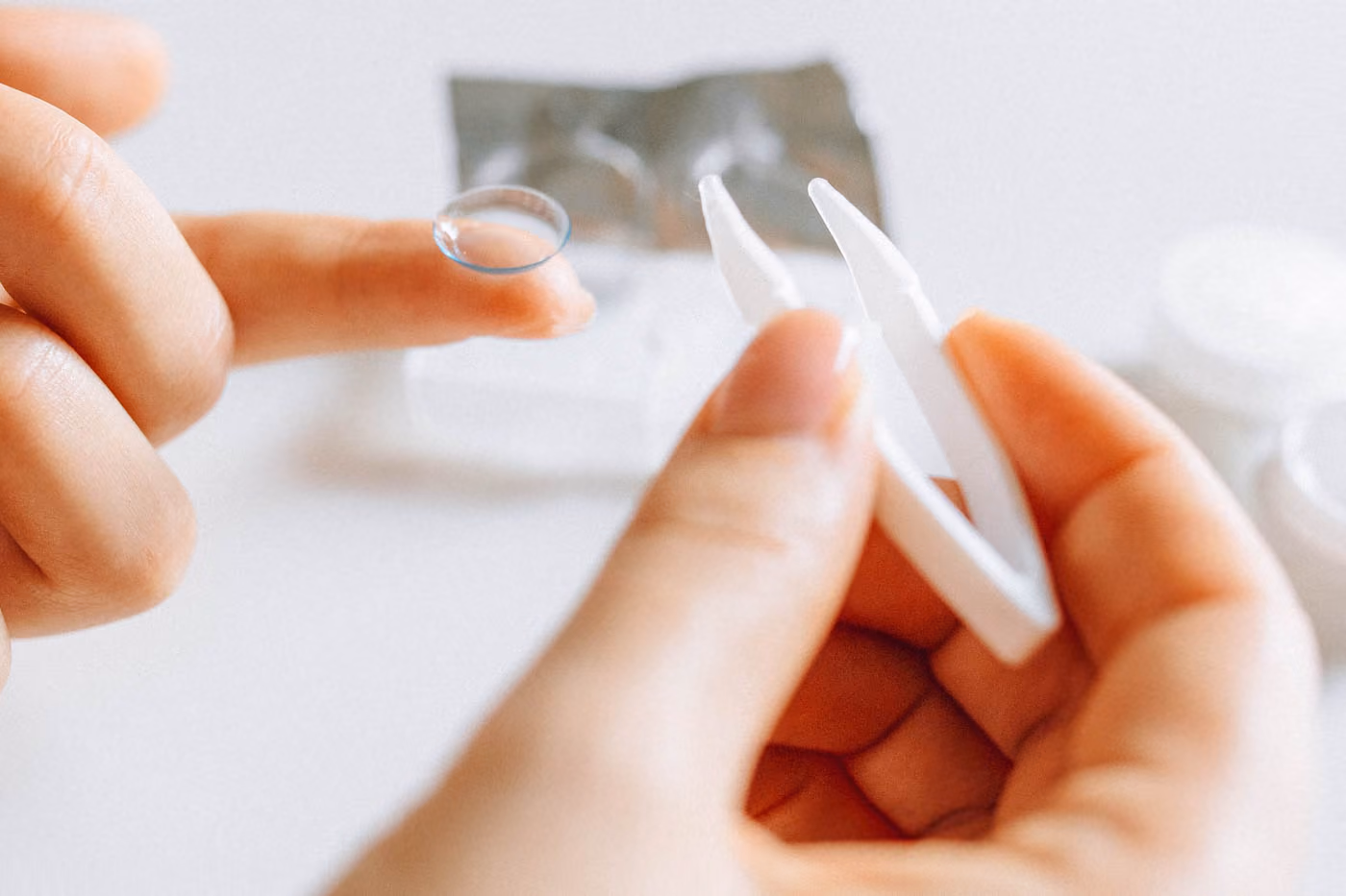Women Holding Contact Lens