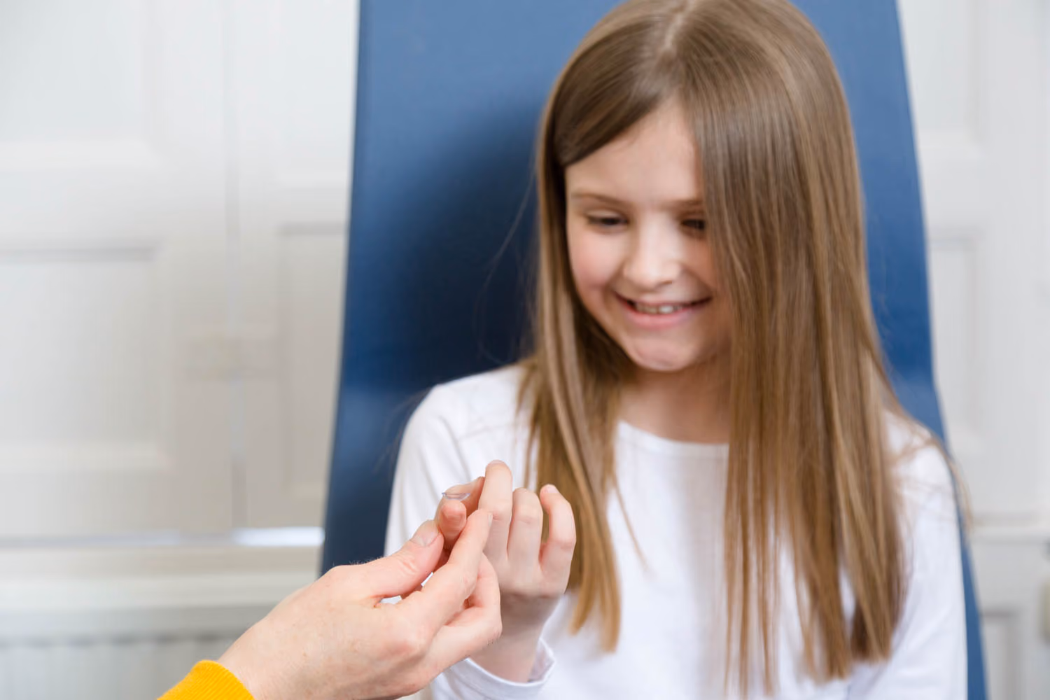 Young Girl Holding Contact Lenses