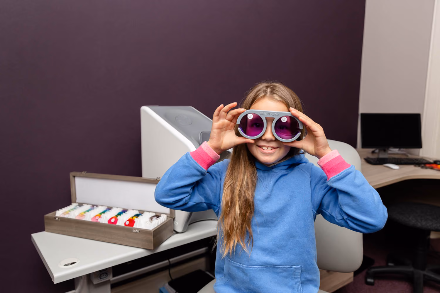 Young Girl Wearing Glasses At Local Opticians