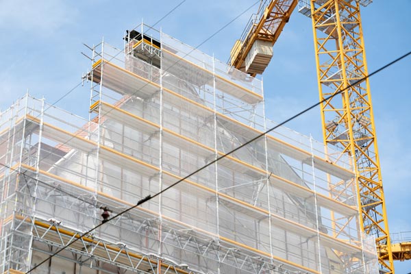 Construction site with scaffolding and crane