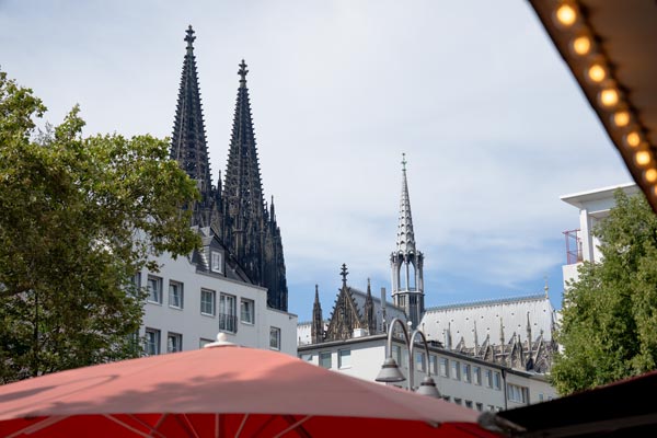 Cologne Cathedral spires above urban rooftops