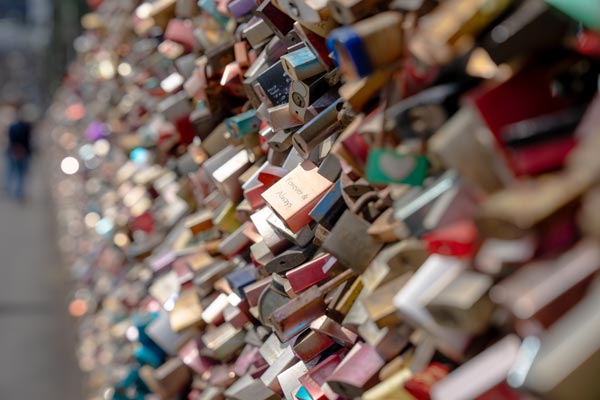 Engraved love lock on Cologne bridge railing