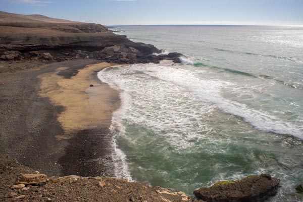 Waves on volcanic beach at Playa de Ajuy