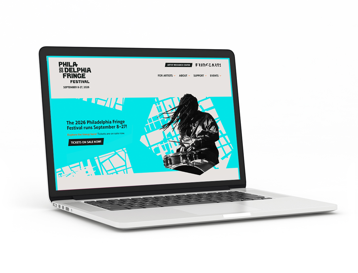 An open laptop displaying the FringeArts website