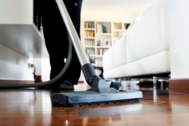 House cleaning services Cheektowaga NY team sanitizing living room