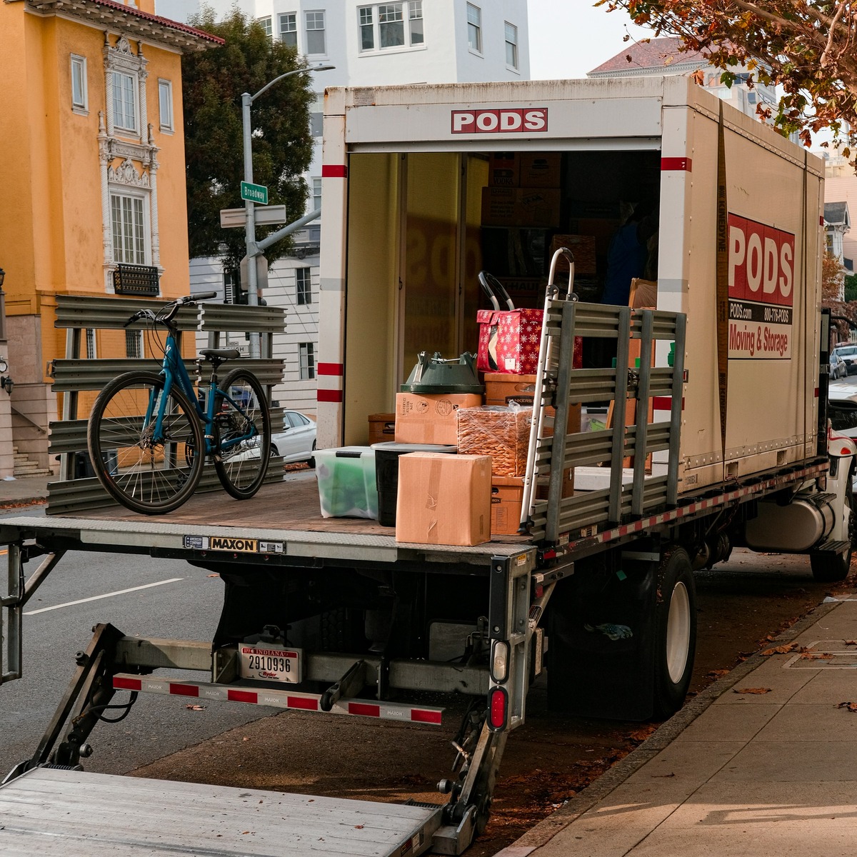 Professional moving truck loaded with boxes, household belongings, and moving equipment, representing heavy furniture movers near me.