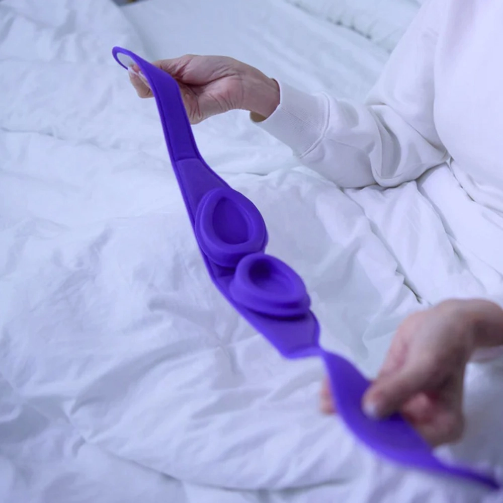 Flexible silicone insert of the Blinkjoy sleep eye mask being stretched, demonstrating soft and comfortable materials for overnight dry eye care