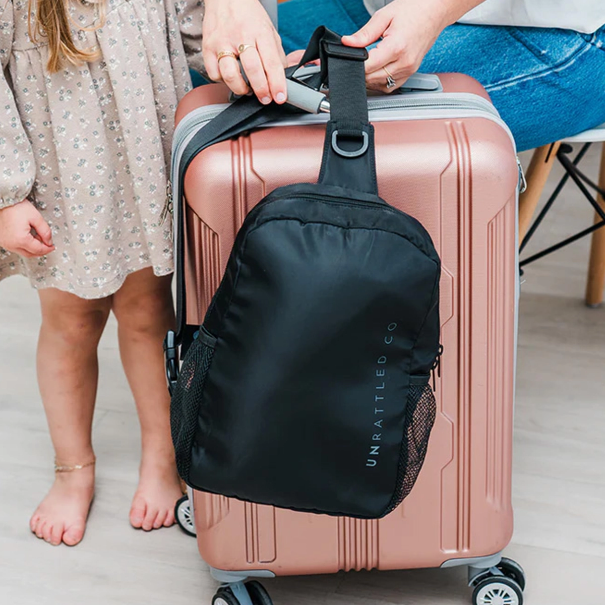 Winglet nursing pillow packed in its travel case, showing compact folded size for carry-on