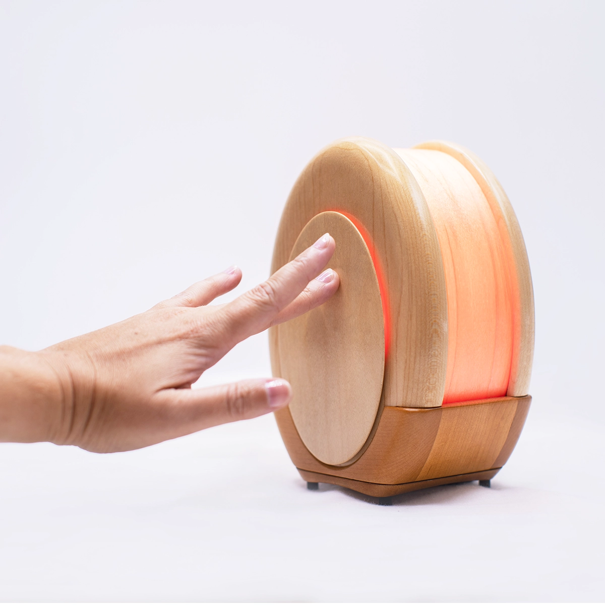 Kulala sleep lamp showing touch-sensitive controls hidden behind maple wood panels