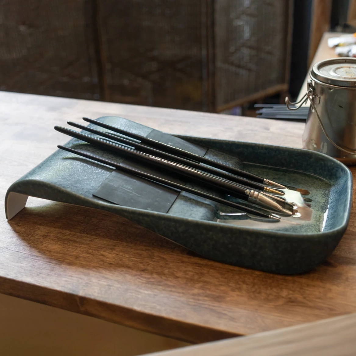 We worked with Savvy Studio Supplies on industrial design for a ceramic brush tray — a sloped, rubber-padded tool that keeps paint brushes elevated and bristles protected between uses.