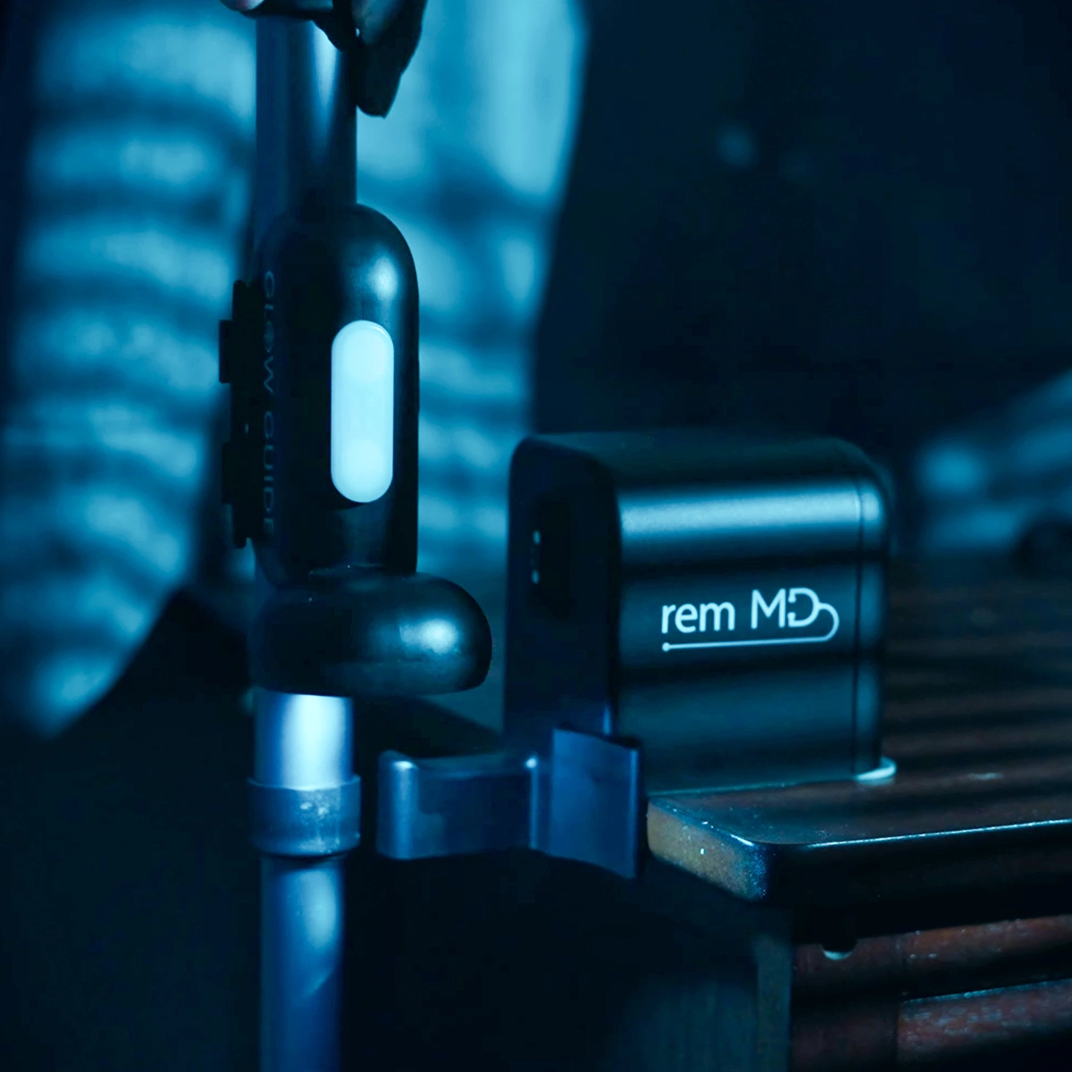Glow Guide emitting soft blue locator glow in a dim environment, making the cane easy to find at night