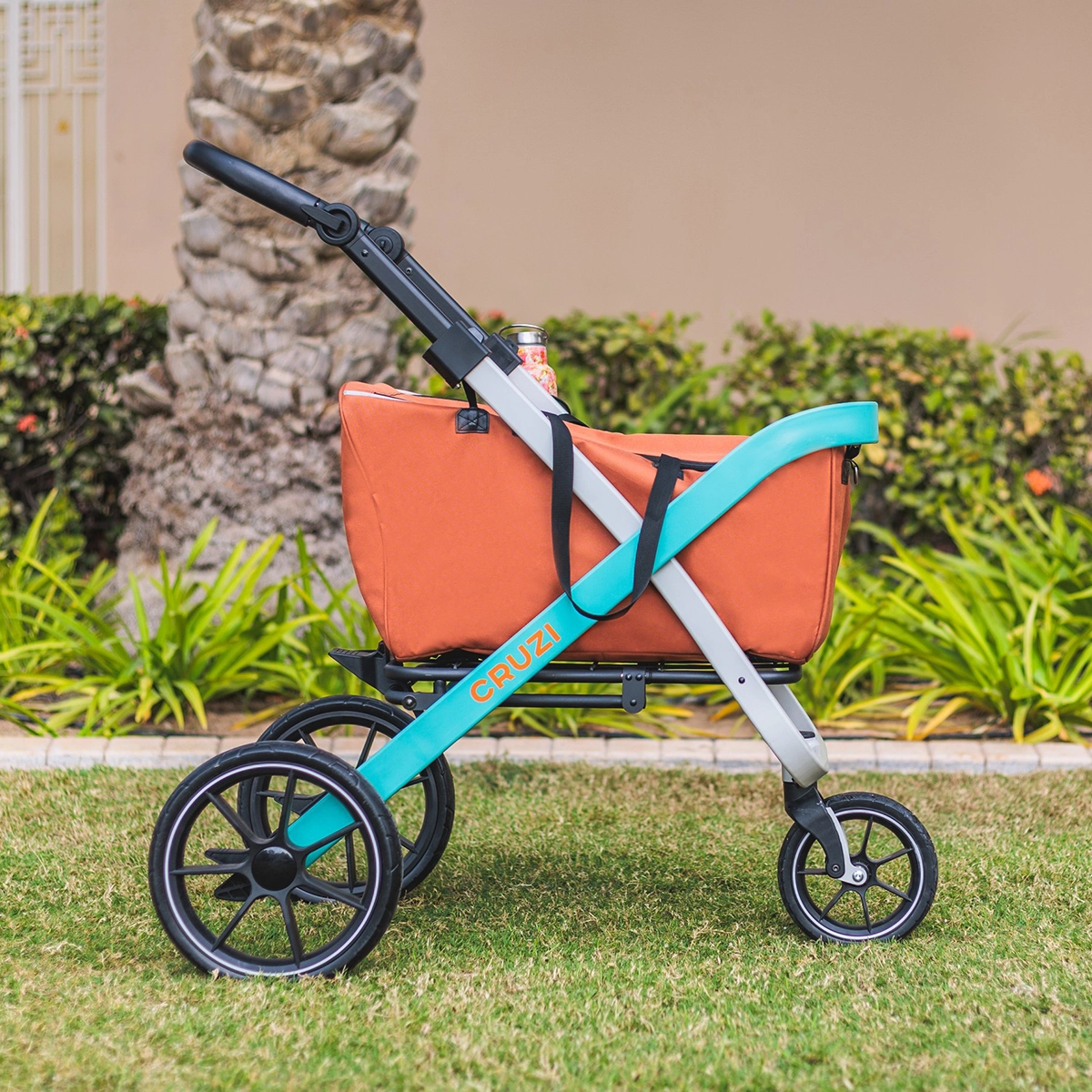 Cruzi urban shopping cart gliding over rough pavement, an all-terrain mobility product designed by Spitfire