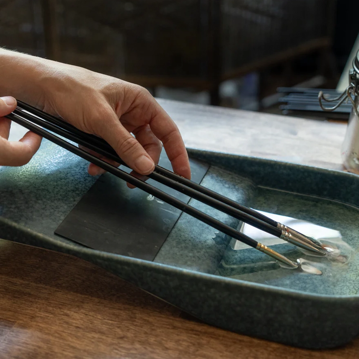 Savvy brush tray's easy-clean glazed ceramic surface, art-supply product design detail by Spitfire