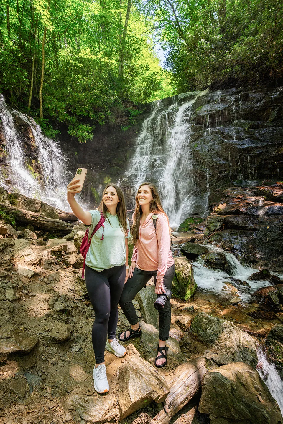 Two woman taking a selfie near a waterfall in Jackson County, NC