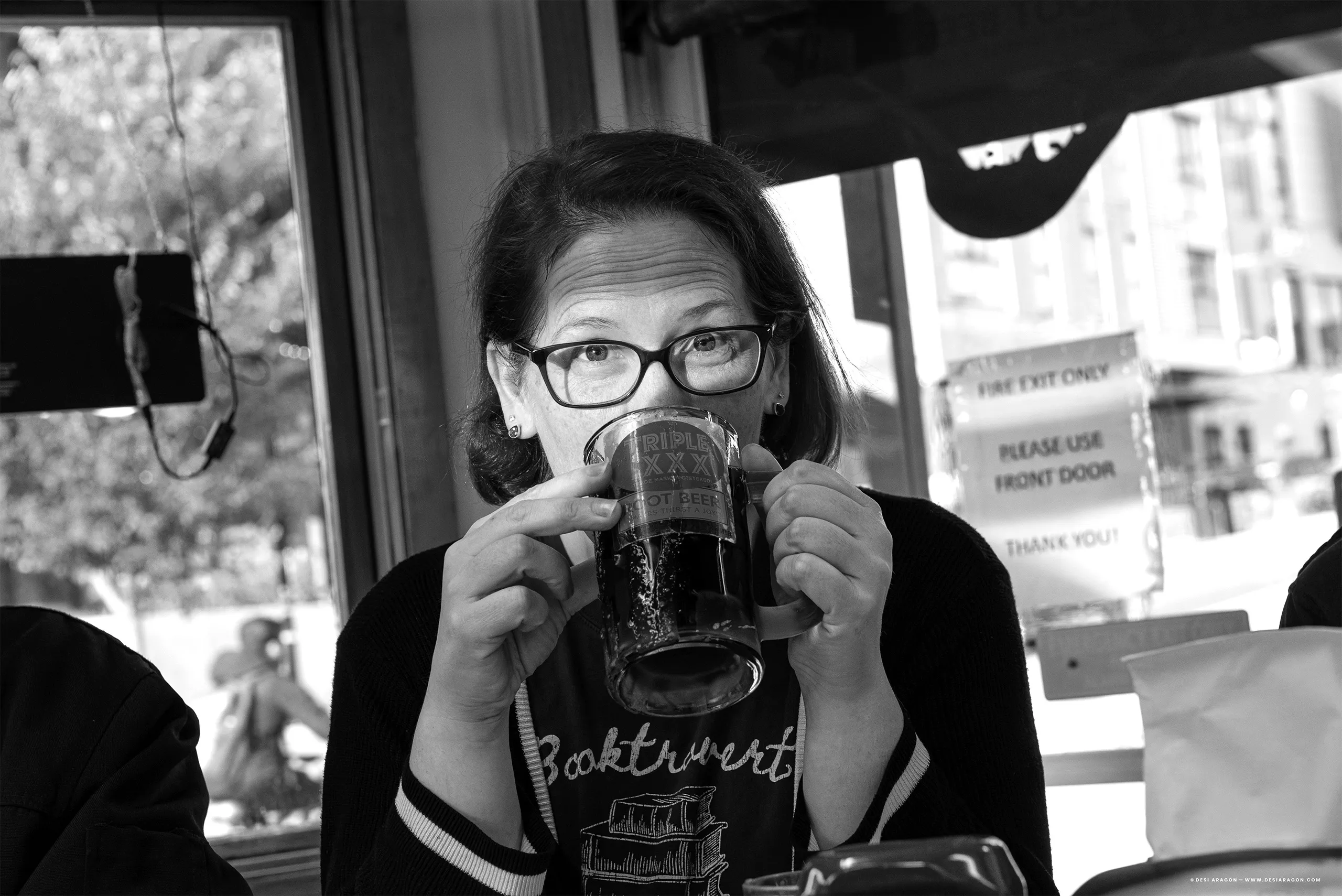 Brandy Ayers holding a mug of Triple XXX root beer