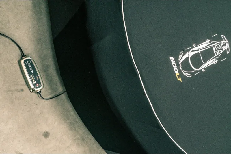 Battery conditioner connected to a supercar in dehumidified storage at Auto Classica, Milton Keynes.