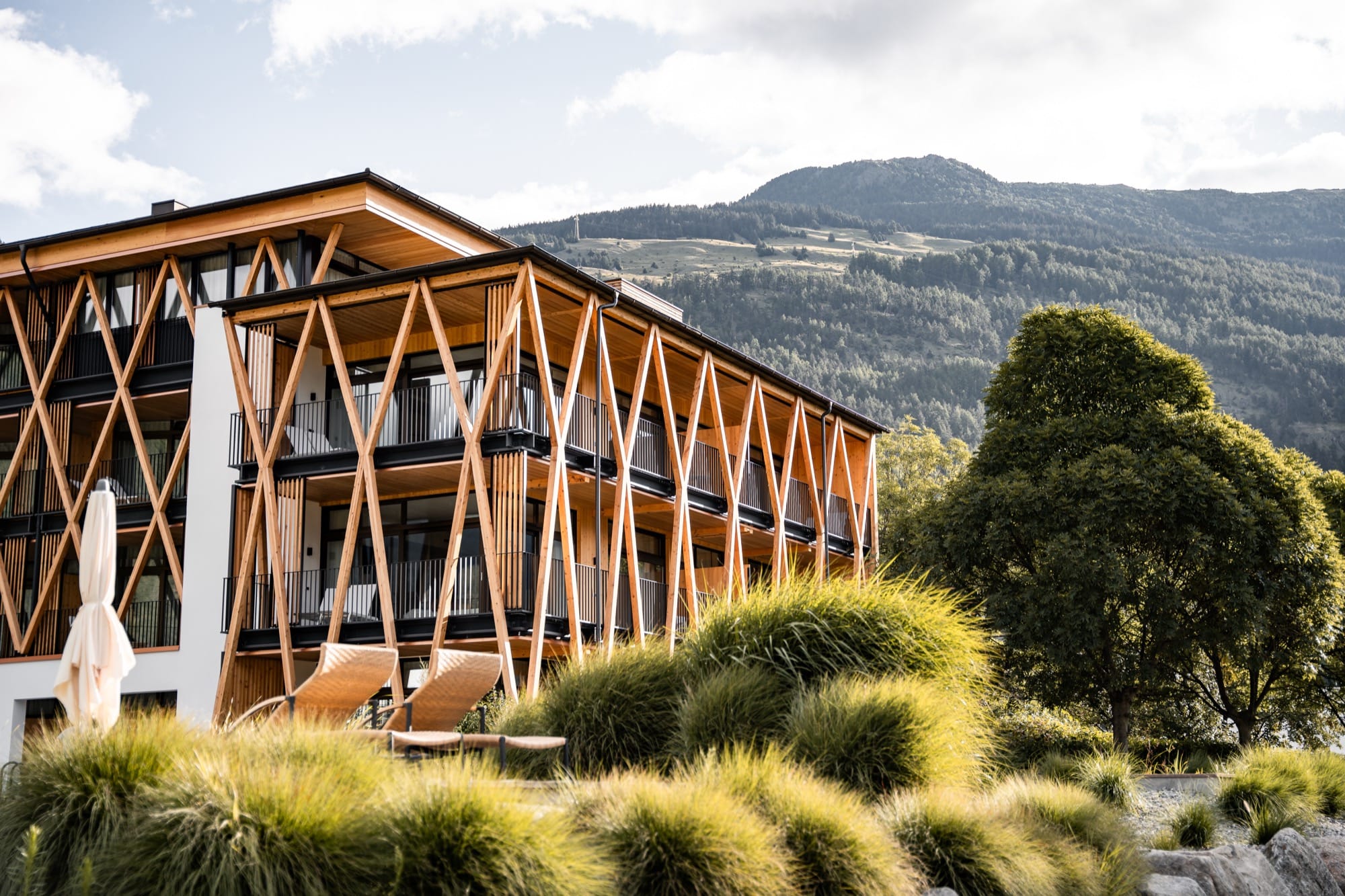 Garberhof wellness hotel in Mals, South Tyrol, Italy with mountain views and natural swimming pond