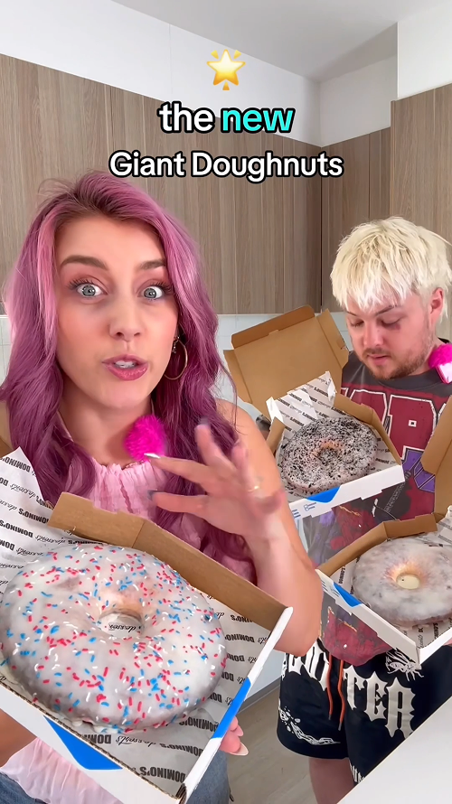 A Red Yolk influencers holding Domino's Lava Cake