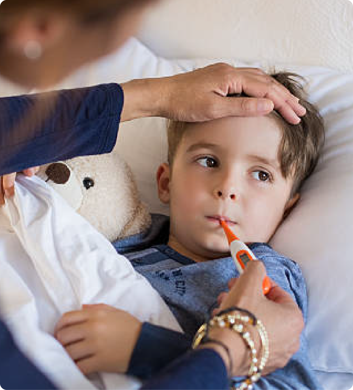 EPH Images: Boy getting his temperature taken