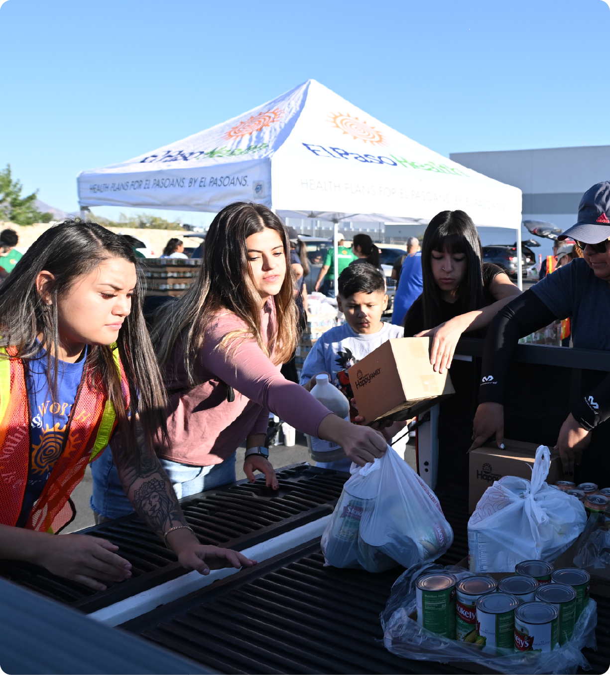 EPH Image: Volunteers at El Paso Health loading food onto a truck