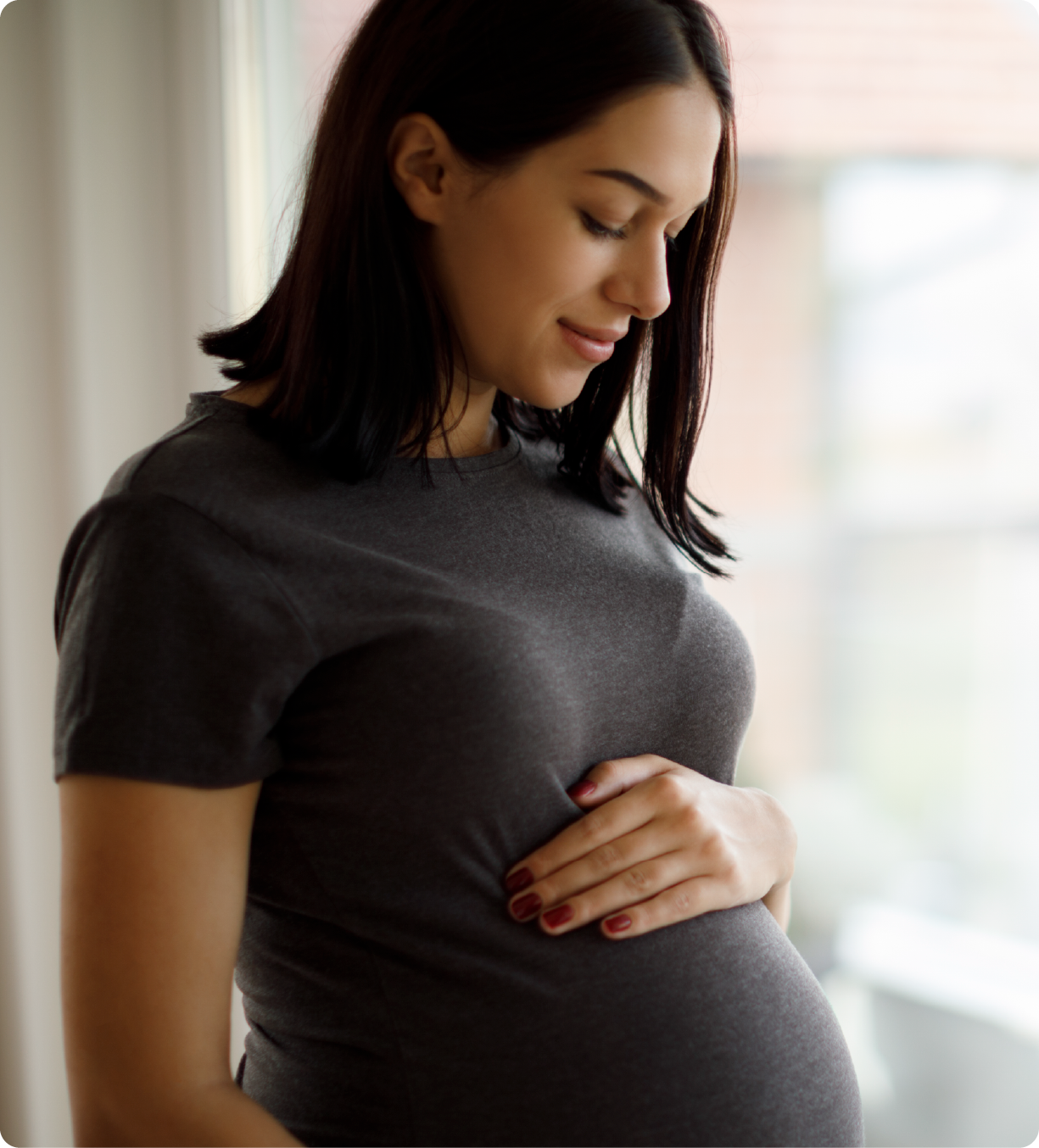EPH Image: Pregnant woman looking down at belly