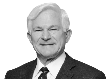 Larry in black and white, wearing a suit with a tie