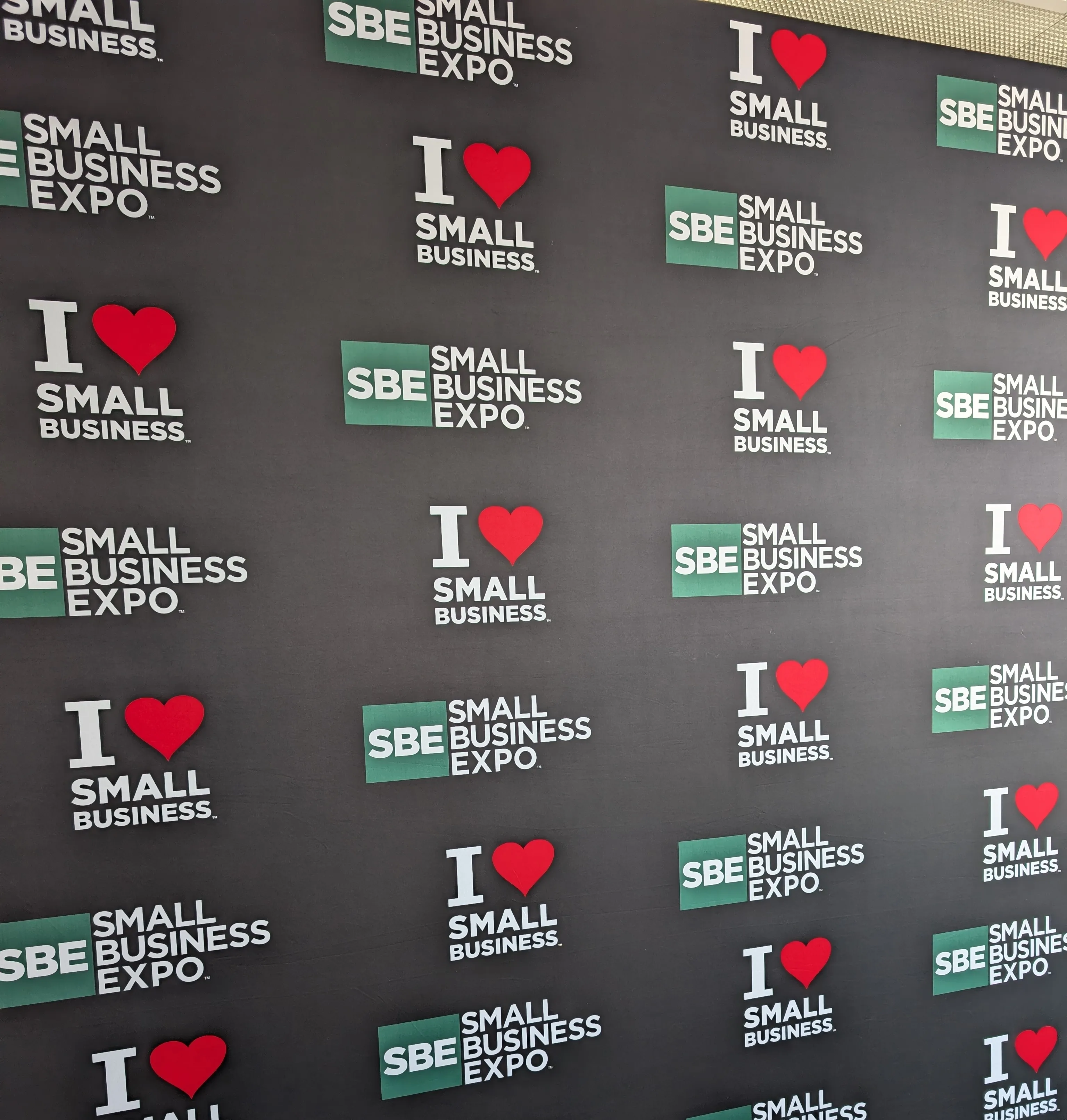 Small Business Expo branded backdrop wall at the event venue