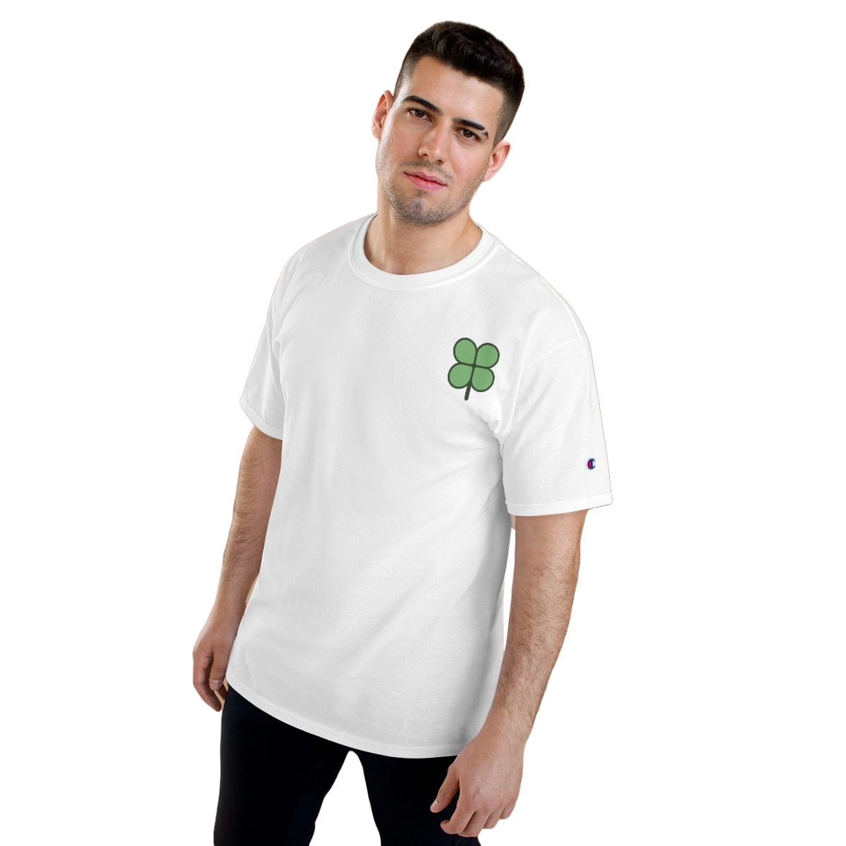 Man wearing a white T-shirt with a green four clover logo placed on the top right corner.