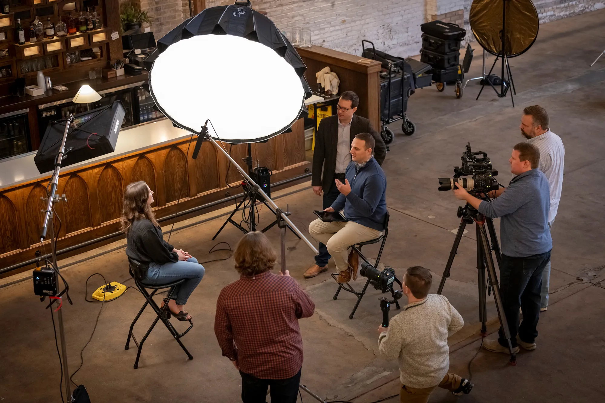 bts of Gillespie team at work filming an interview