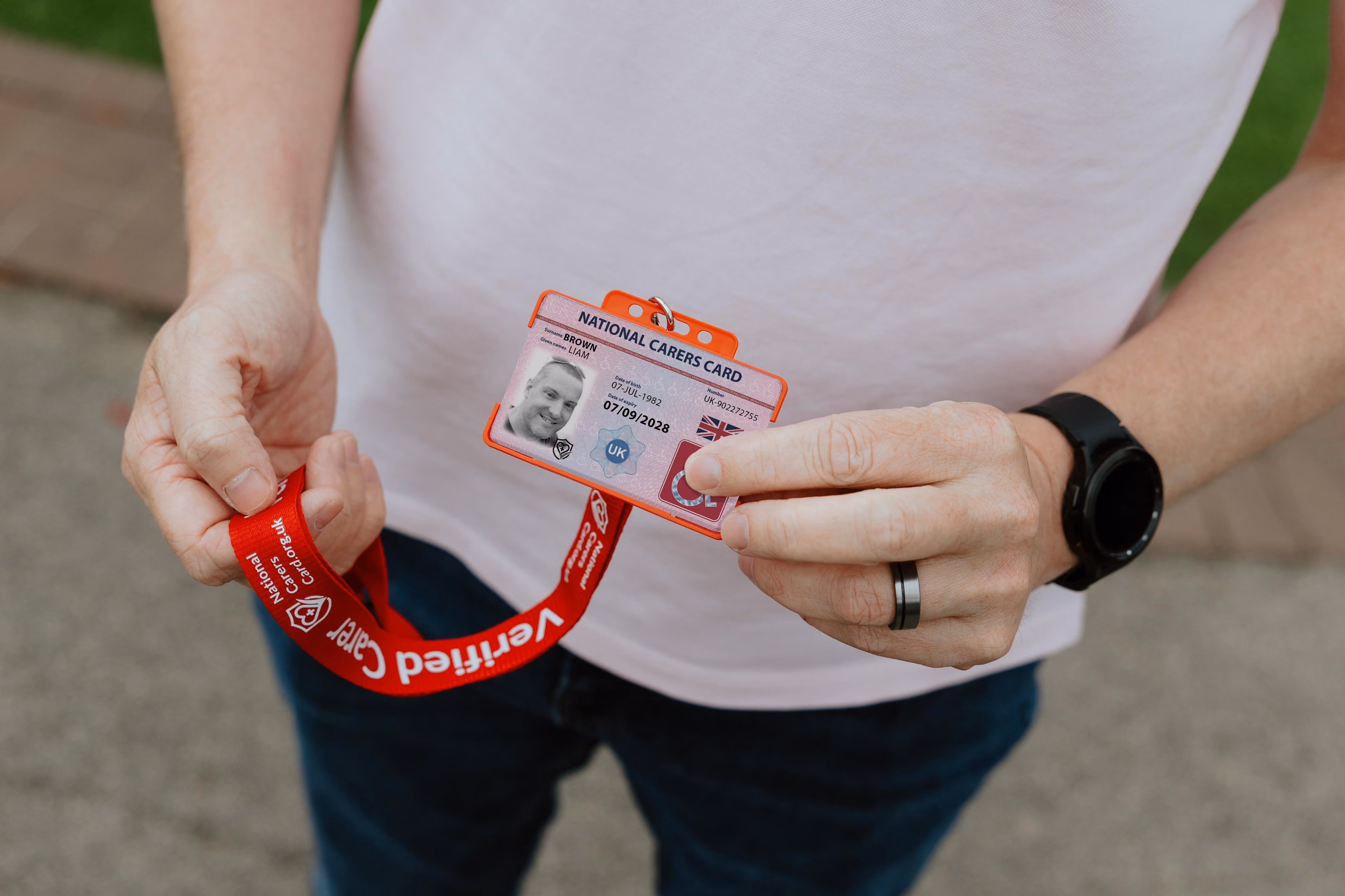 national disability card holder showing her card at a venue for carer ticket access