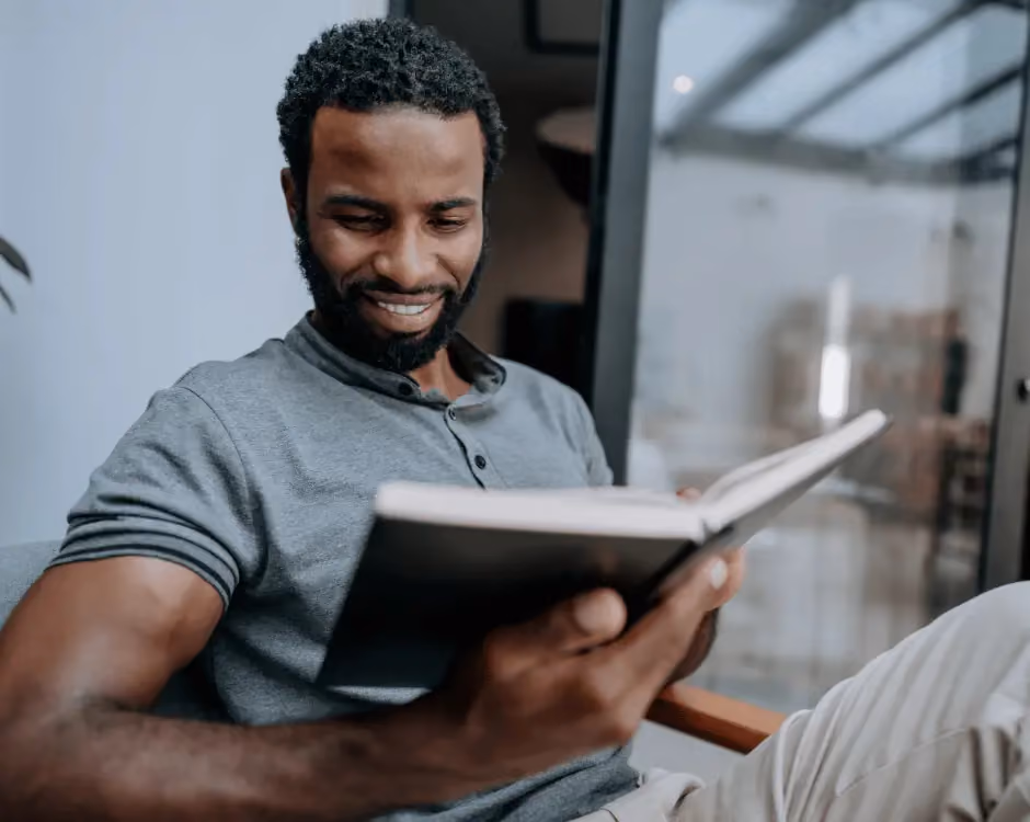 Photo of a man reading a book