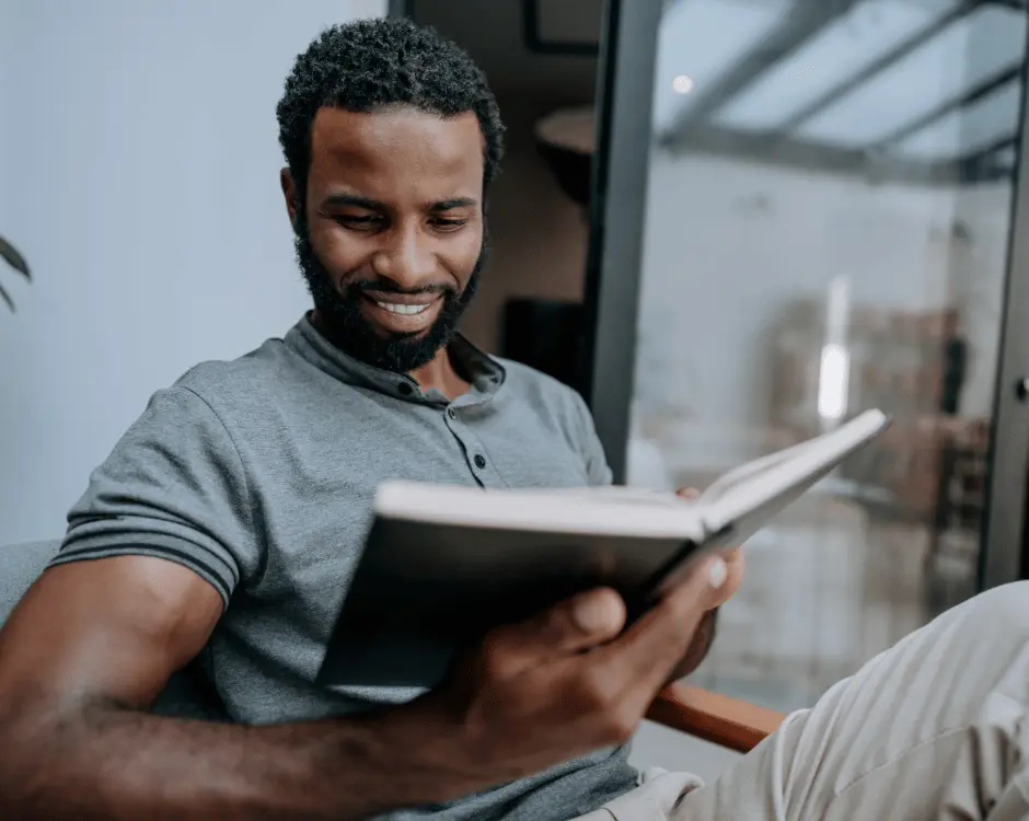 Photo of a man reading a book