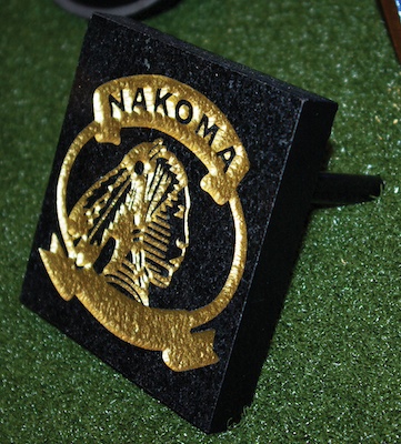 black carved granite with gold painted logo