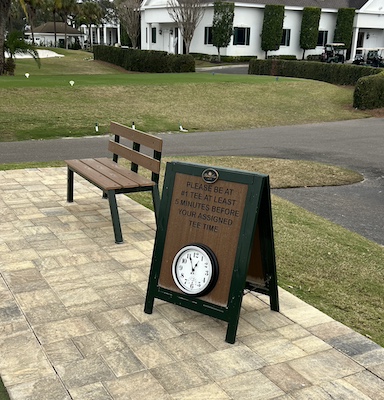 a frame informational sign with built in clock