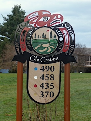 carved sandstone sign with aluminum cut branding