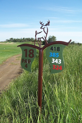 layered metal tee sign with cut metal branding elements