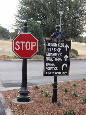 carved black granite teee sign with stop sign and matching posts