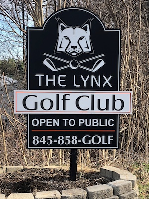 routed black and white welcome sign