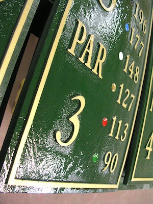 freshly polished cast bronze sign