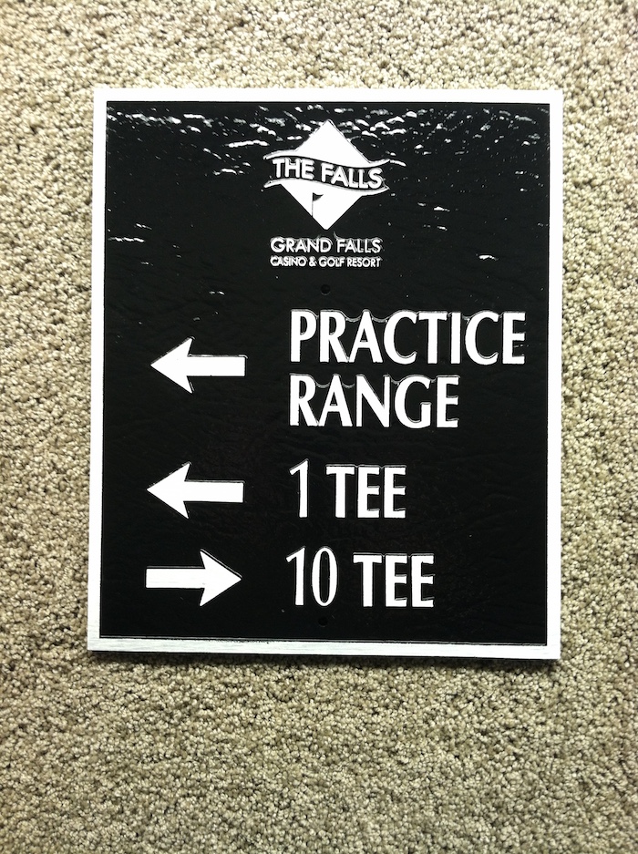 cast metal directional sign