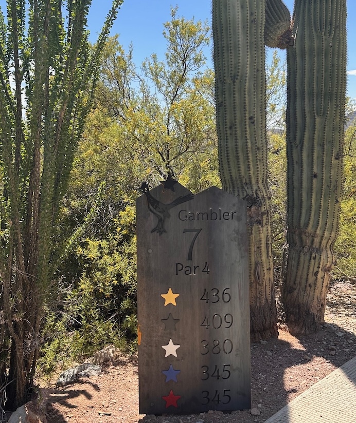 steel tee sign on desert golf course