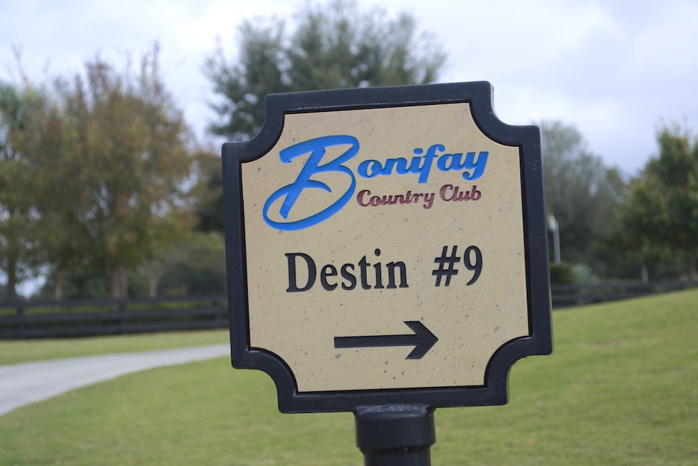 sandstone directional sign with aluminum frame