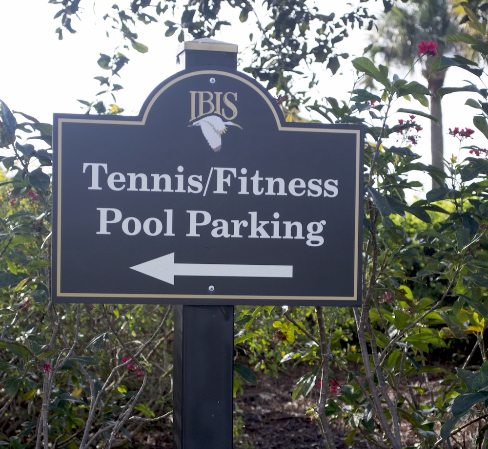 metal directional sign with vinyl overlay