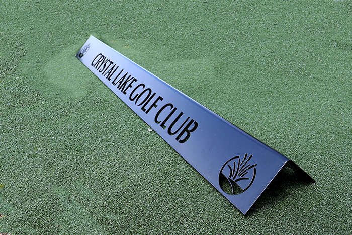 aluminum range divider grass reading Crystal Lake Golf Club with golf course logo icons at each end.