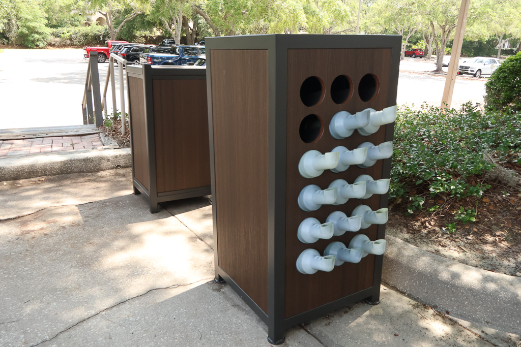 Outdoor wooden and metal divot bottle holder outside of the clubhouse