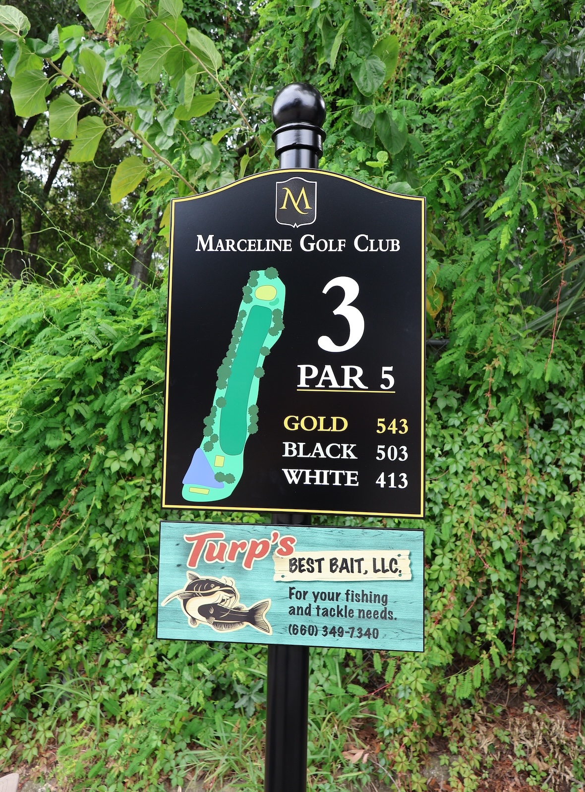 Marceline Golf Club hole 3 par 5 sign showing course layout and distances for gold, black, and white tees.