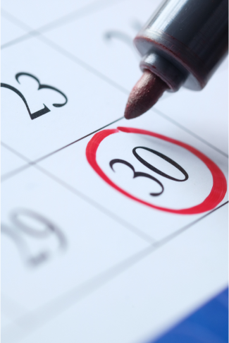 Red marker circling the 30th on a paper calendar